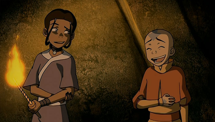 Aang and Katara laughing together in a warm setting, showcasing moments from Avatar The Last Airbender quotes.