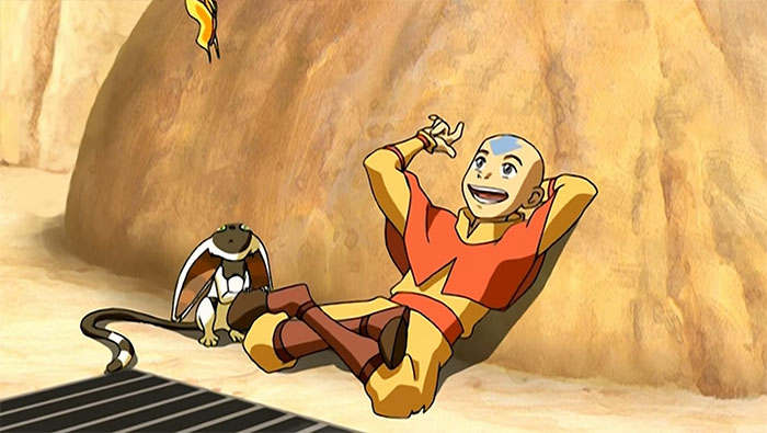 Aang relaxing and talking with Momo in a desert setting from Avatar The Last Airbender quotes scene.