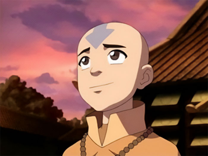 Aang from Avatar The Last Airbender looking sincere with a peaceful sunset background and traditional clothing.
