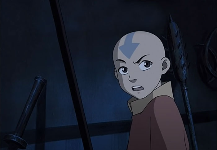 Aang looking confused in a dark room, representing iconic moments from Avatar The Last Airbender quotes.