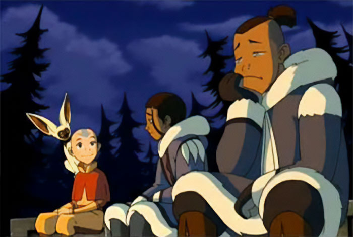 Aang sitting with Momo, Katara, and Sokka outdoors at night, a scene from Avatar The Last Airbender quotes.