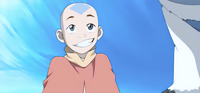 Aang smiling against a bright blue sky, representing iconic moments from Avatar The Last Airbender quotes.