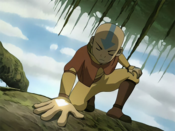 Aang from Avatar The Last Airbender connecting with the banyan grove tree using his spiritual powers.