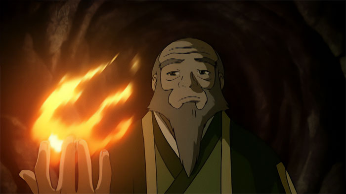 Uncle Iroh performing firebending inside a cave, showcasing a powerful flame in his hand from Avatar The Last Airbender quotes.