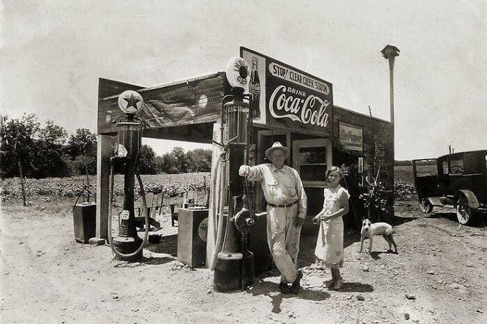 Gas Station Owner With Daughter And Dog In Front Of The Station In Clear Creek