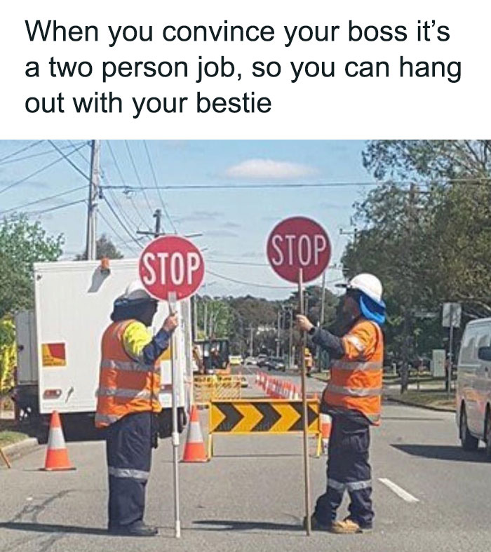 Two construction workers humorously hold stop signs, embodying friendship memes about working with your best friend.