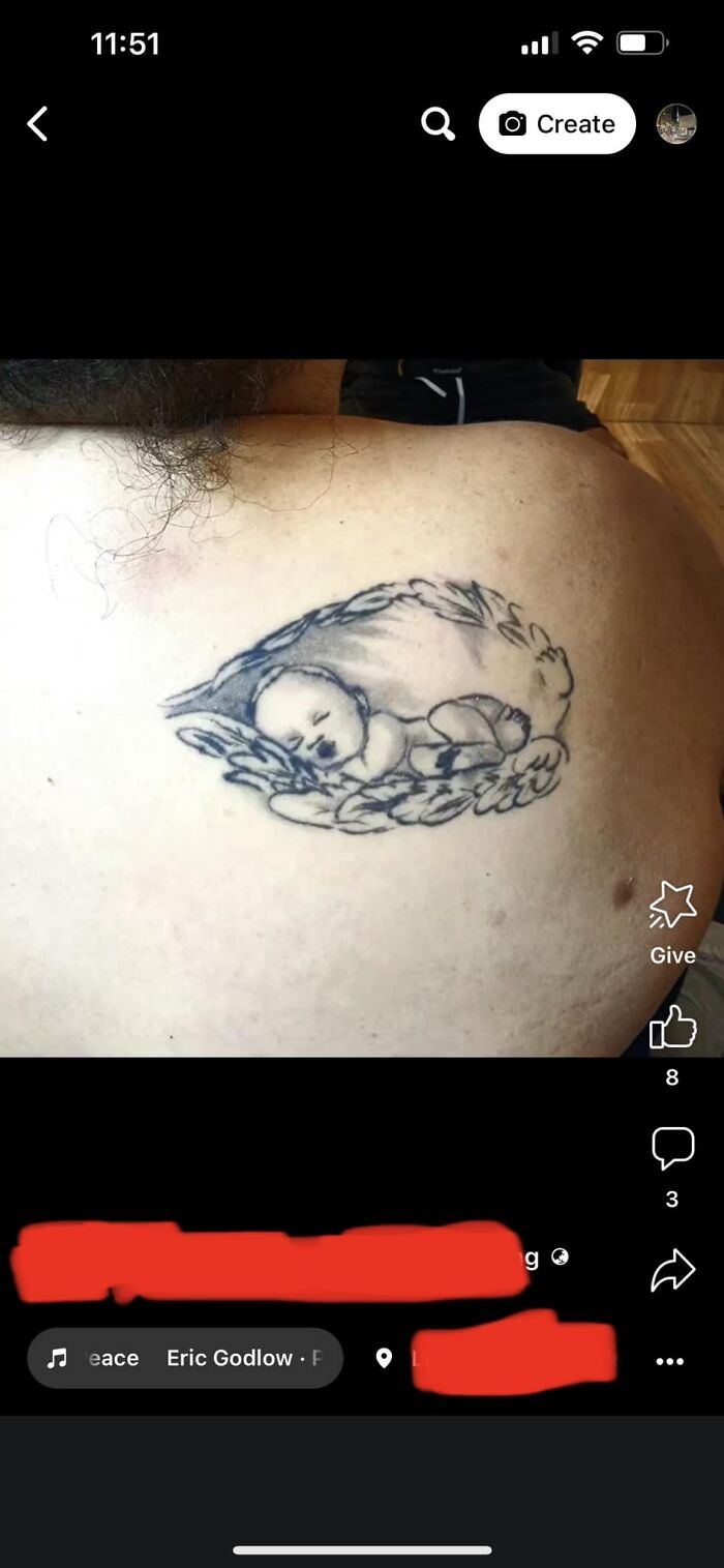 Worst tattoo depicting a sleeping baby with wings on a person's back.
