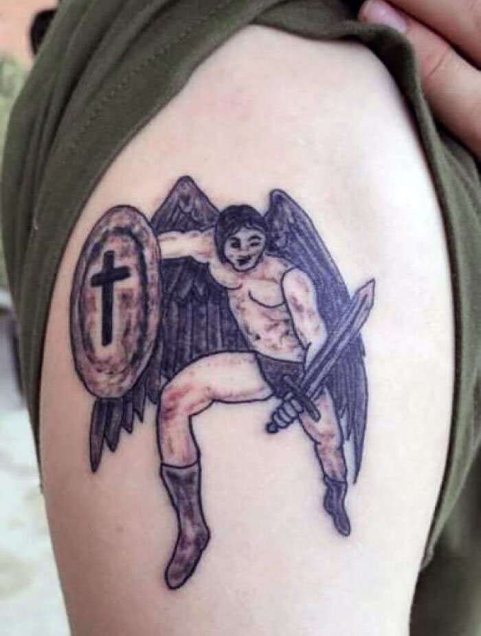 Tattoo with an angel holding a shield and sword, representing common permanent inked mistakes people make.
