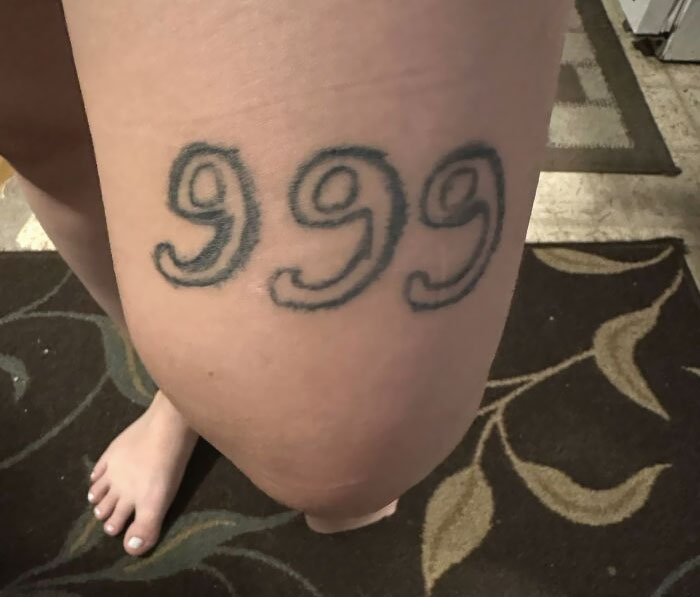 "Leg tattoo with the number 999, illustrating a permanent mistake some make with ink."