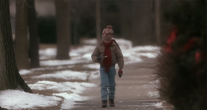 Kevin McCallister looking at toothbrush and walking from Home Alone