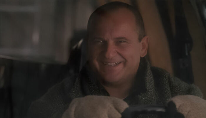 Harry driving and smiling from Home Alone