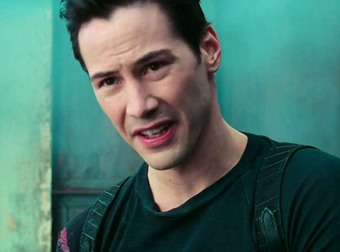 Keanu Reeves wearing black shirt