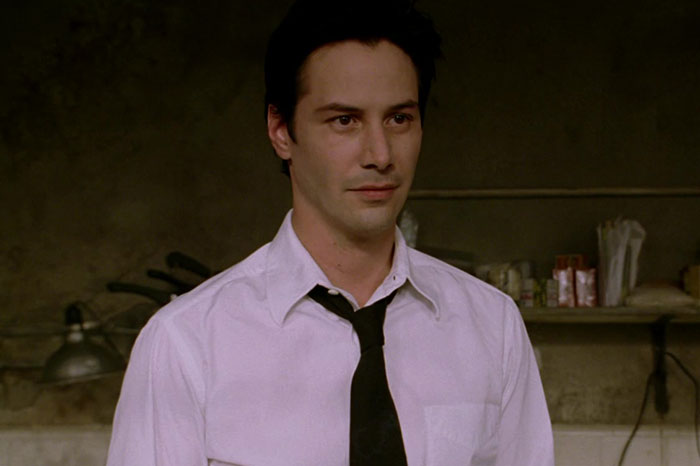 Keanu Reeves wearing white shirt