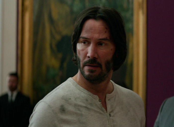 Keanu Reeves wearing white shirt