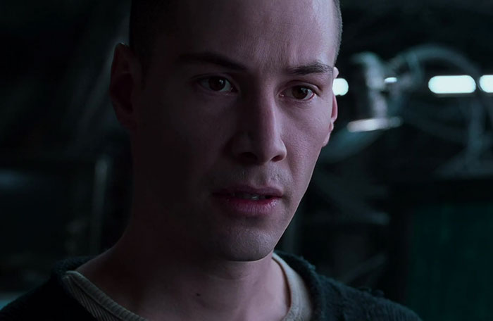 Keanu Reeves wearing white and black shirt