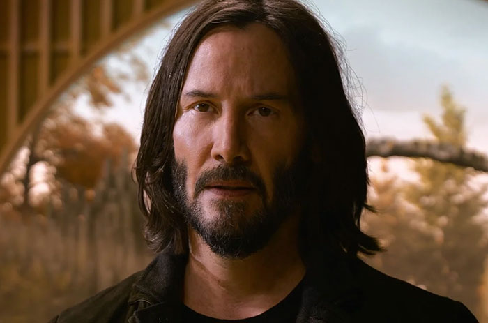 Keanu Reeves wearing brown jacket