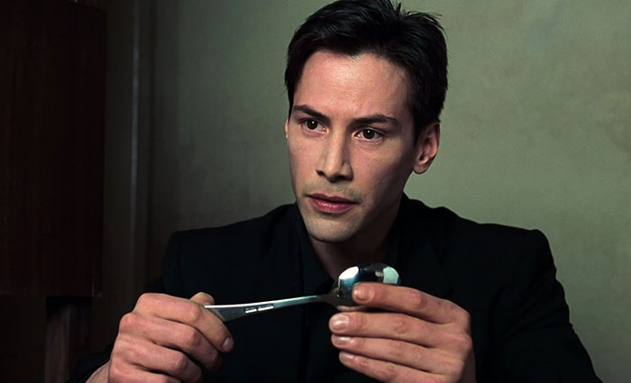 Keanu Reeves wearing black suit