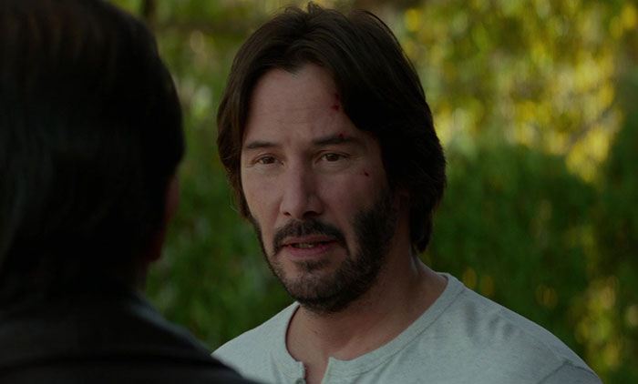 Keanu Reeves wearing white shirt