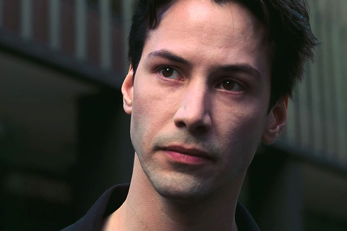 Keanu Reeves wearing black shirt