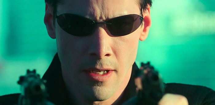 Keanu Reeves wearing glasses