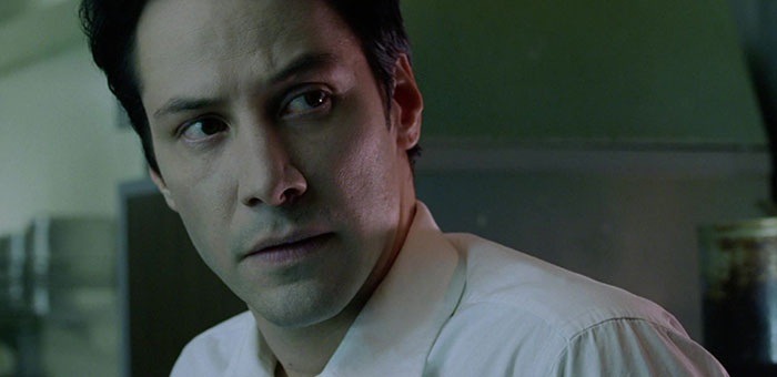 Keanu Reeves wearing white shirt