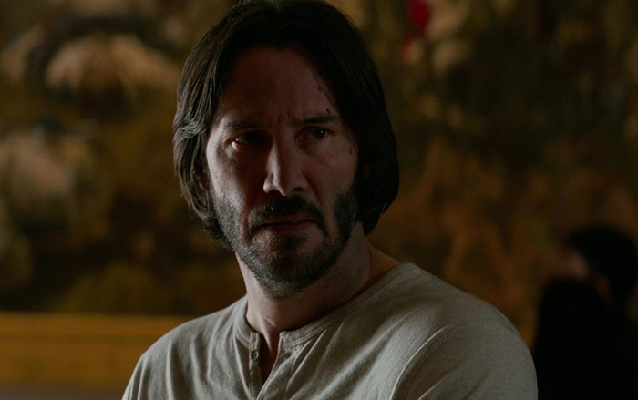 Keanu Reeves wearing white shirt