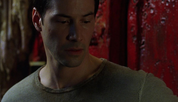 Keanu Reeves wearing green shirt