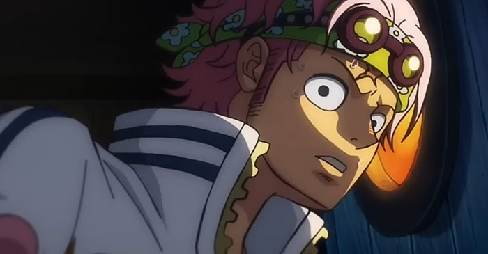 Coby wearing white suit