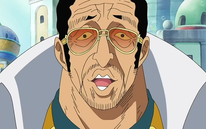 Kizaru wearing suit and glasses