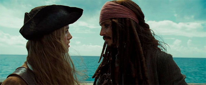 Jack Sparrow and Elizabeth facing each other on a ship with ocean backdrop in Pirates of the Caribbean quotes scene.