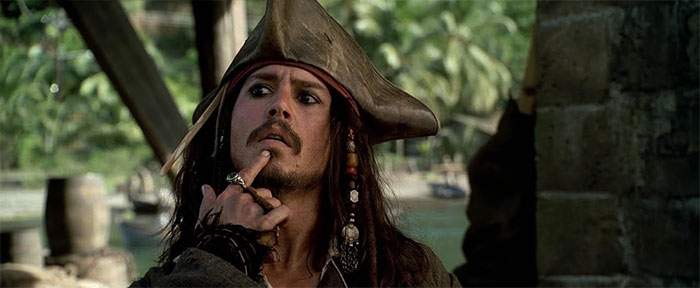 Jack Sparrow from Pirates of the Caribbean thinking with a pensive expression, representing iconic Pirates of the Caribbean quotes.