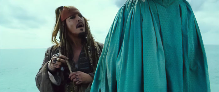 Jack Sparrow from Pirates of the Caribbean looking up at a tall person, capturing iconic pirates quotes moment.