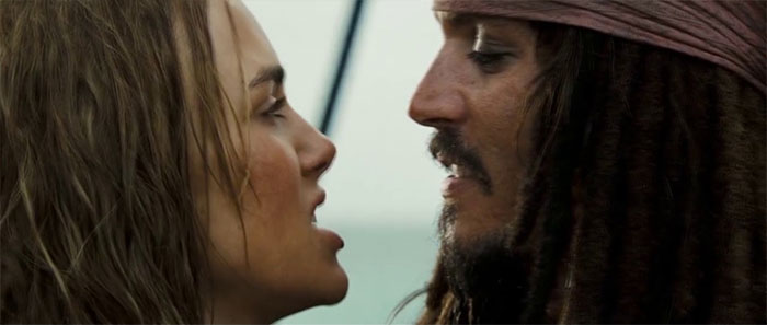 Elizabeth Swann and Jack Sparrow close-up scene from Pirates of the Caribbean, featuring iconic pirates of the Caribbean quotes.