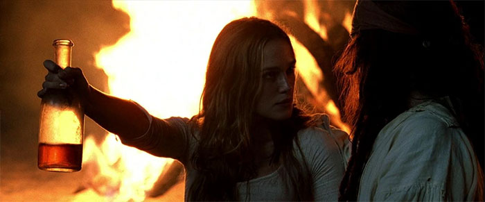 Jack Sparrow and Elizabeth in Pirates of the Caribbean scene with bottle as part of Pirates of the Caribbean quotes treasure.