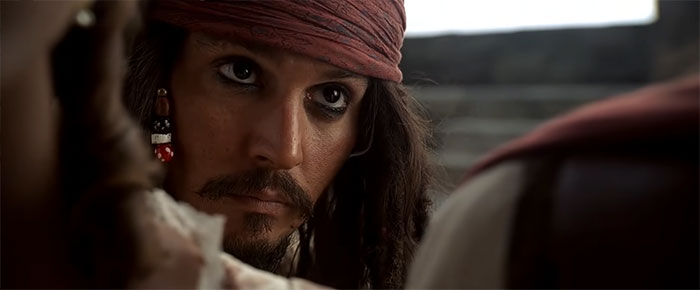 Jack Sparrow from Pirates of the Caribbean looking intently at someone in a close-up scene full of pirate quotes atmosphere