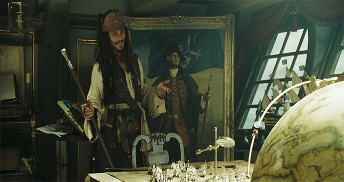 Jack Sparrow imitating a painting in a dimly lit room filled with nautical maps and pirate artifacts from Pirates of the Caribbean quotes.
