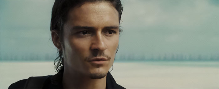 Will Turner looking thoughtfully into the distance, capturing the spirit of Pirates of the Caribbean quotes and adventure.