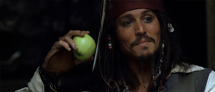 Jack Sparrow from Pirates of the Caribbean holding a green apple, showcasing iconic Pirates of the Caribbean quotes.