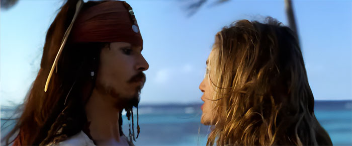 Jack Sparrow and Elizabeth Swann in a close conversation scene from Pirates of the Caribbean featuring iconic pirate quotes.