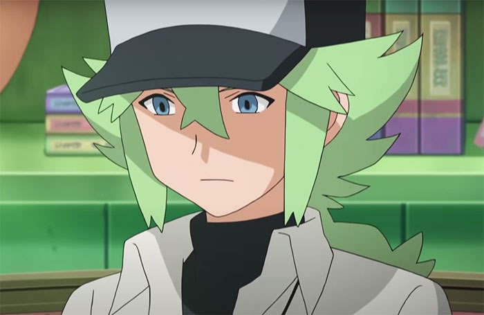 Pokémon character N with a hat is sitting - 1