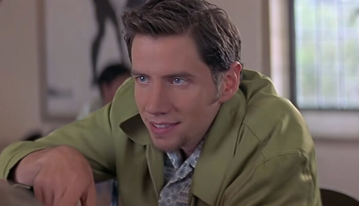 Randy looking at someone and talking 