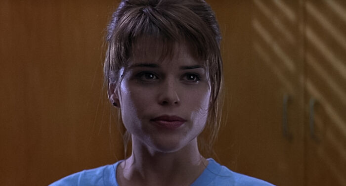 Sidney standing in a bright room 