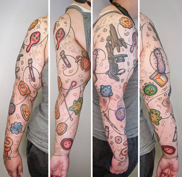 Colorful science tattoos with microscope, test tubes, and microbes on a person's arm, showcasing scientific art.