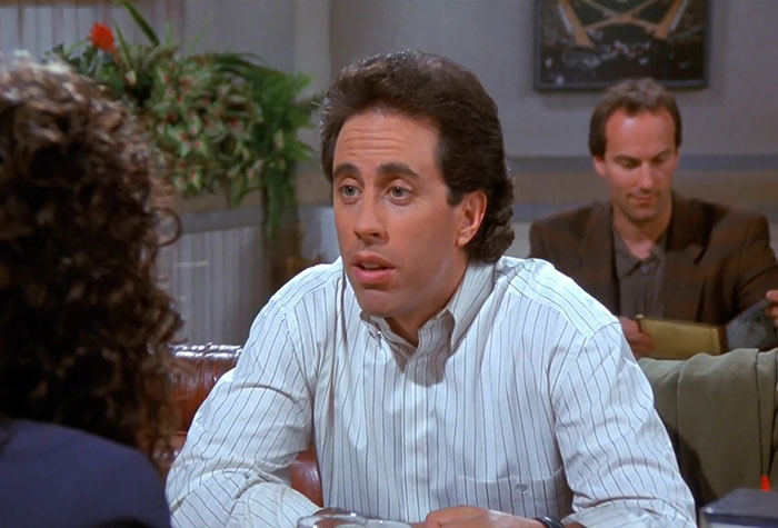 Jerry from Seinfeld wearing a white shirt, captured during a scene featuring funniest Seinfeld quotes about everyday life.