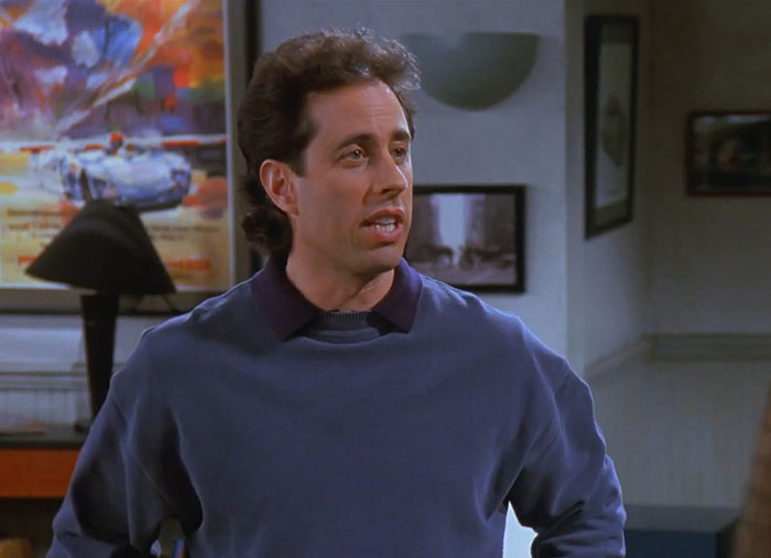 Jerry wearing a blue sweater delivering one of the funniest Seinfeld quotes about everyday life in a classic sitcom scene