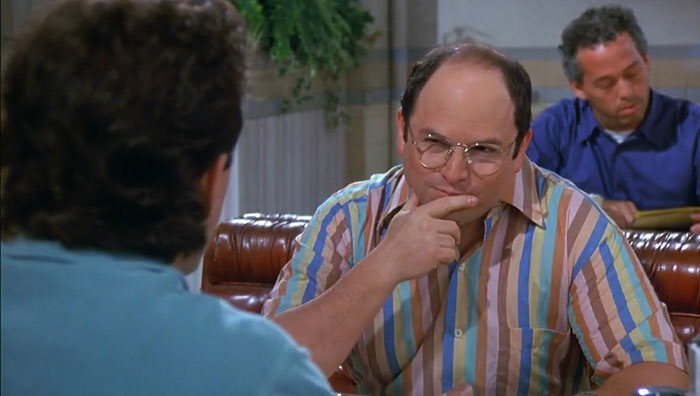 George from Seinfeld wearing a colorful striped shirt, illustrating funniest Seinfeld quotes about everyday life moments.