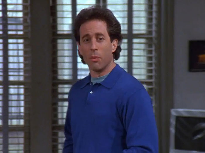 Jerry wearing a blue sweater delivering one of the funniest Seinfeld quotes that sum up everyday life moments.