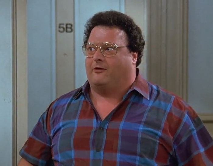 Newman from Seinfeld wearing a colorful shirt, representing funny Seinfeld quotes that sum up everyday life.