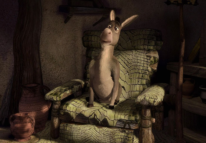 Donkey sitting on a worn green chair inside a rustic room, representing a scene from Shrek quotes about the deep swamp.