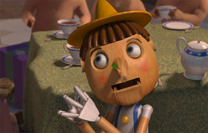 Pinocchio talking with a leaf on his nose in a scene from the animated Shrek quotes about the deep swamp.